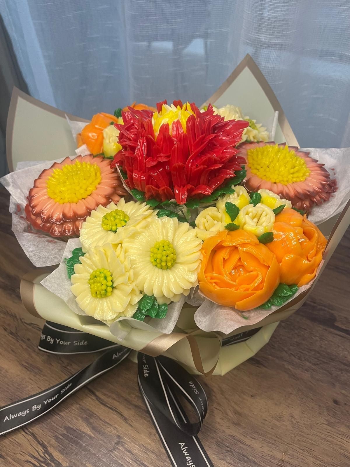 Colorful carved vegetable bouquet resembling flowers, with red, yellow, orange, and cream hues.