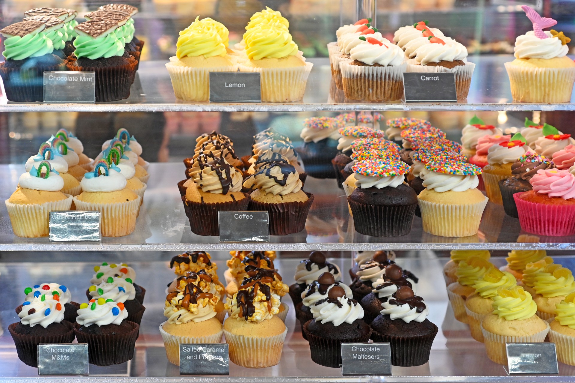 Delicatessen bakery store with variety of cupcakes